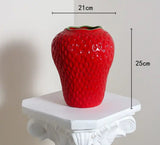 Strawberry Vase in red on pedestal, perfect for home decor or as a gift.